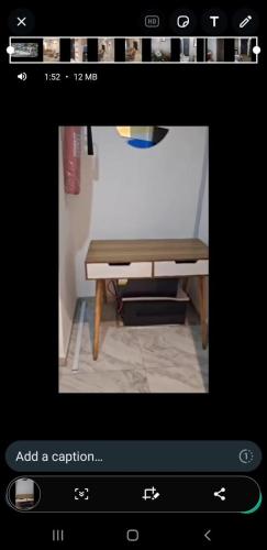 a picture of a wooden table in a room at Mengary Apartment in Suru Lere