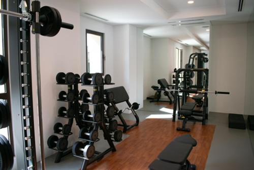 a fitness room with several treadmills and weights at Spectacular 2BR Apartment Full BurjAlArab View in Dubai