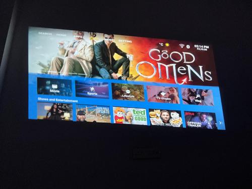 a television screen with a bunch of movies on it at Videep house in Kānpur