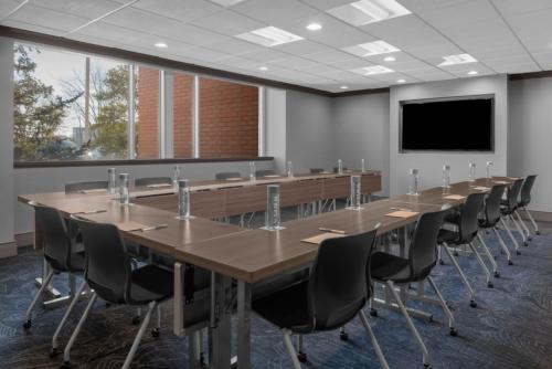 a conference room with a long table and chairs at Renaissance Indianapolis North Hotel in Carmel
