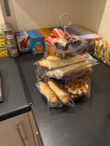 a group of sandwiches and pastries on a counter at The Singlecote Hotel in Lincolnshire