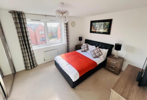 a bedroom with a large bed and a window at Elegant Double Room with Ensuite in Central Reading in Reading