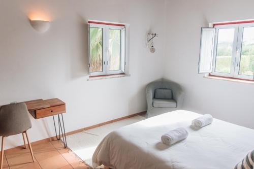 Ένα ή περισσότερα κρεβάτια σε δωμάτιο στο Casa Nook Arrifana