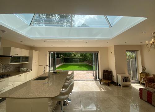 a large kitchen with a large skylight in a house at The Woodstock in Birmingham