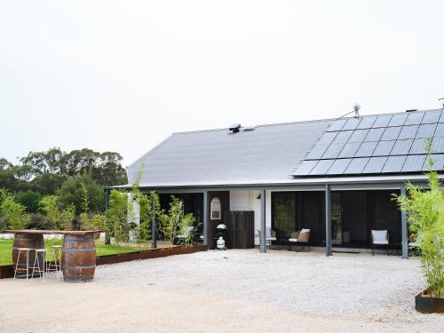 a house with solar panels on top of it at Shawwood Estate in Mudgee