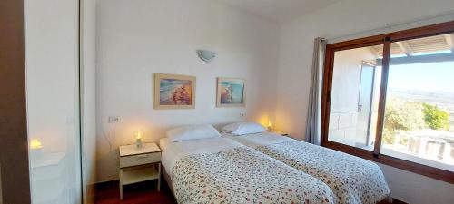 a white bedroom with a bed and a window at The Black Horse Canarias - Adults Only in Maspalomas