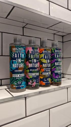 a shelf with a bunch of cans of fat n nutrients at Sidney Grove B&B in Newcastle upon Tyne