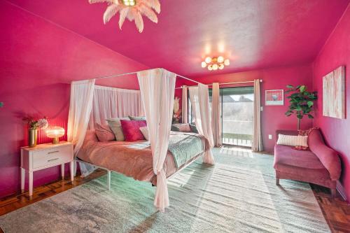 a bedroom with pink walls and a bed with a canopy at 18 bd w Indoor Pool Hottub & Sauna - Mystery Room in East Stroudsburg