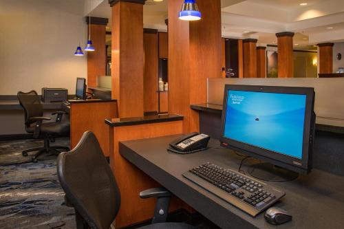 an office with a computer monitor and a keyboard and mouse at Fairfield Inn and Suites by Marriott Harrisonburg in Harrisonburg
