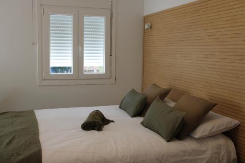 En eller flere senge i et værelse på Bambú Suites Vegueta