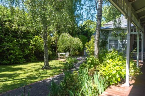 a house with a garden in front of it at Heytesbury House in Cobden