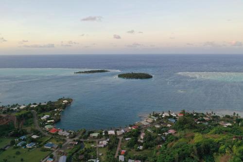 an aerial view of a small island in the ocean at Camping TENUI in Taputapuapea