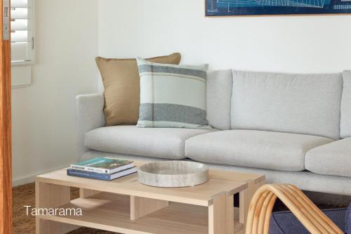 a living room with a couch and a coffee table at Bluewater on the Beach in Byron Bay