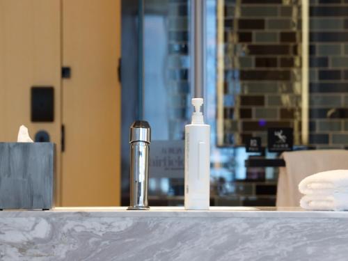 a soap dispenser and a bottle on a counter at Fairfield by Marriott Changsha Tianxin in Changsha