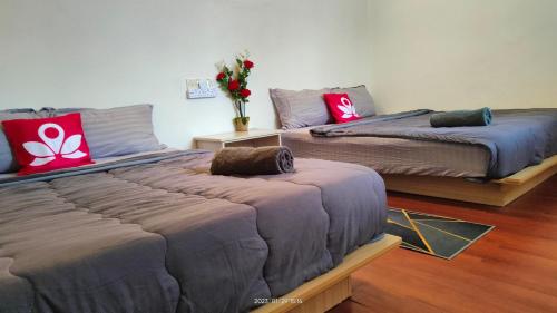 Laman Hanaz - Homestay Auniにあるベッド