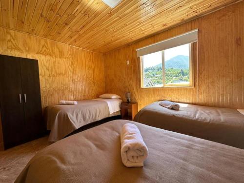 เตียงในห้องที่ Paraiso Patagonico