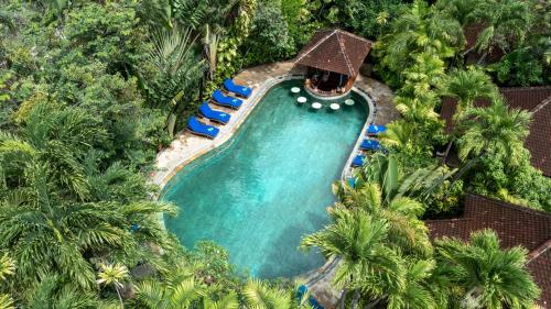 an overhead view of a swimming pool in a resort at Tonys Villas & Resort Seminyak - Bali in Seminyak
