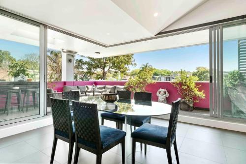 a dining room with a table and chairs at Modern spacious 3 bedroom penthouse in Enmore in Sydney