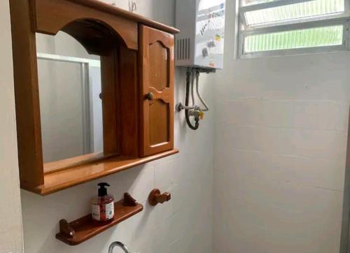 a bathroom with a sink and a medicine cabinet at Apto Leme RJ- Lindo 2 quartos. A uma quadra da praia. in Rio de Janeiro