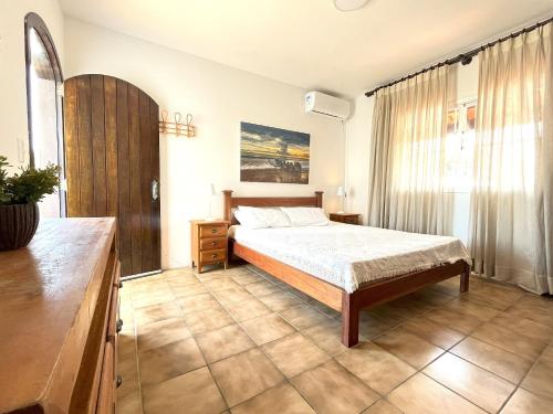 Ένα ή περισσότερα κρεβάτια σε δωμάτιο στο Extraordinária casa Pé na Areia - Piçarras