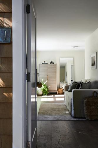 a bedroom with a bed and a living room at The Roundtree, Amagansett in Amagansett