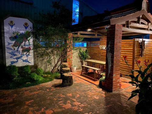 Κήπος έξω από το 臺窩灣台南包棟民宿Taiwan Heritage House A Cultural Stay in Tainan 全新房間2-12人4房6衛4床2廳1廚房
