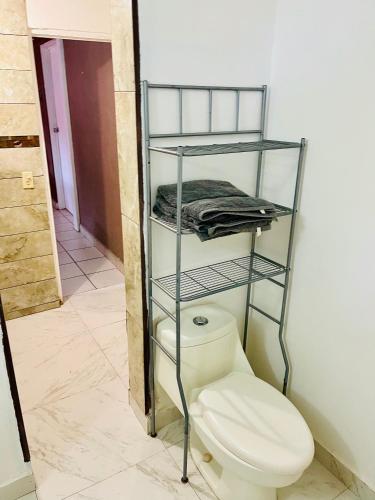 a bathroom with a toilet in a room at Casa El Pescador in Mulegé