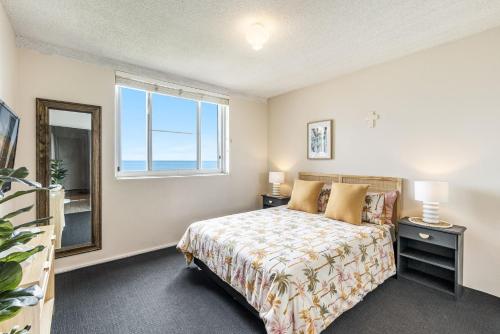 Ένα ή περισσότερα κρεβάτια σε δωμάτιο στο Craigmore 7 - Front Row Seats to Sunrise