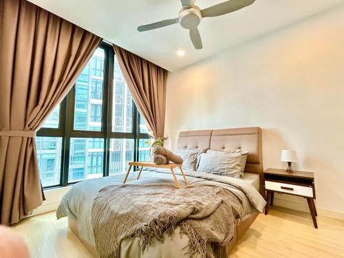 a bedroom with a bed and a ceiling fan at 1-8 pax Comfort Place 3room Ara Damansara in Petaling Jaya