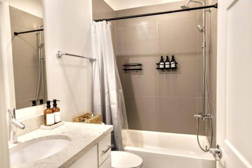 a bathroom with a shower and a toilet and a sink at Comfortable Modern Home in Downtown Houston - Sleeps 10 in Houston