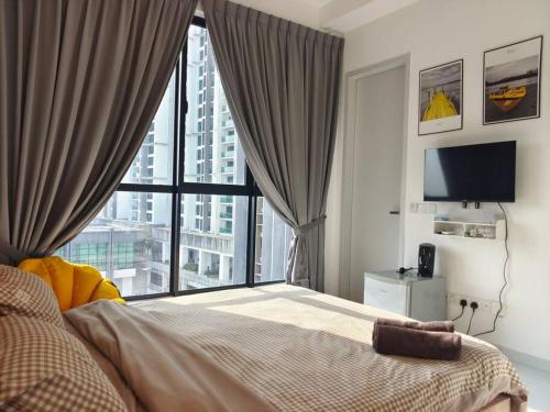 a bedroom with a bed and a large window at Skytree A0802-(2) Nobles Room / Aeon in Johor Bahru