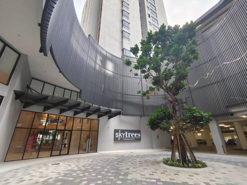 a tree in the middle of a shopping mall at Skytree A0802-(2) Nobles Room / Aeon in Johor Bahru