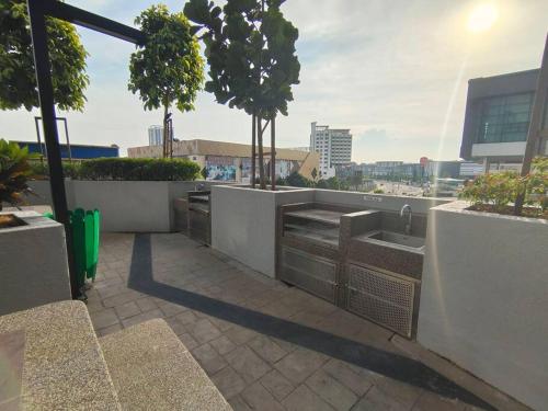 an outdoor kitchen with a view of a city at Skytree A0802-(2) Nobles Room / Aeon in Johor Bahru