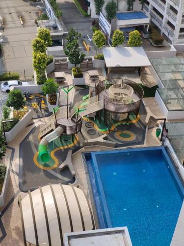 an overhead view of a swimming pool in a hotel at Skytree A0802-(2) Nobles Room / Aeon in Johor Bahru