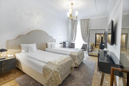 Кровать или кровати в номере Hotel Palace