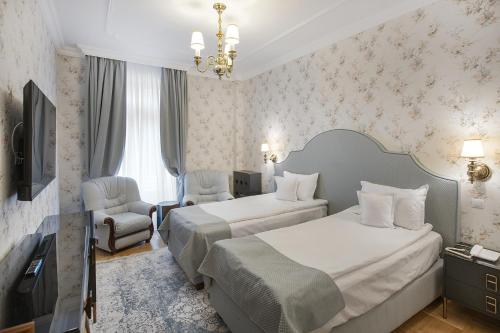 Кровать или кровати в номере Hotel Palace