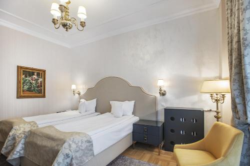 Кровать или кровати в номере Hotel Palace