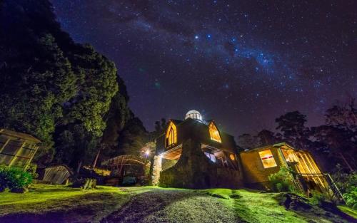 a house under a starry sky at night at Happy Nest in Jackeys Marsh