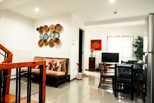 a living room with a couch and a table at 87 Guesthouse in Baguio