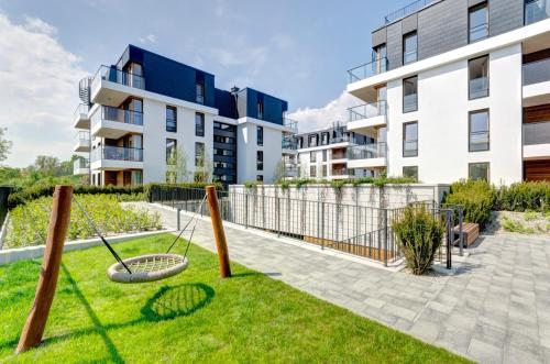an image of an apartment yard with swings at Beach&Nature - Bursztynowa in Gdańsk
