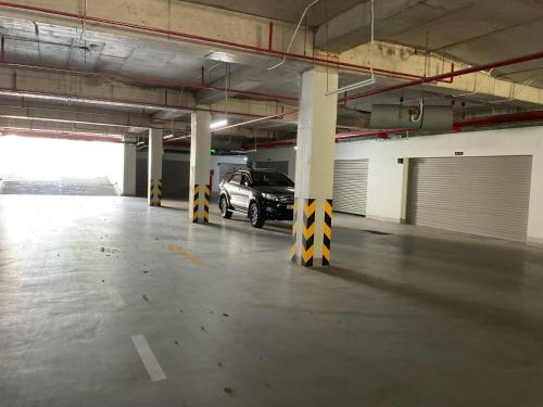 a parking garage with a car parked in it at Green Inn Phu Quoc Hotel in Phu Quoc
