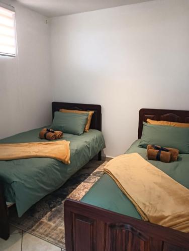 Habitación con 2 camas en una habitación en 612 @ Leisure Bay en Pretoria