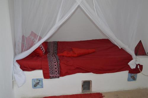Postel nebo postele na pokoji v ubytování Ella's Swahili House