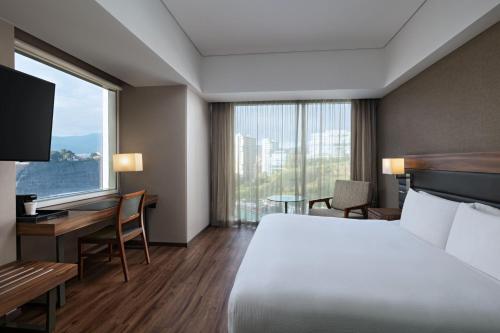 Ένα ή περισσότερα κρεβάτια σε δωμάτιο στο AC Hotel by Marriott Santa Fe