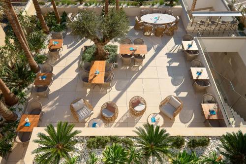 an overhead view of a restaurant with palm trees at Mirari Boutique Hotel in Split
