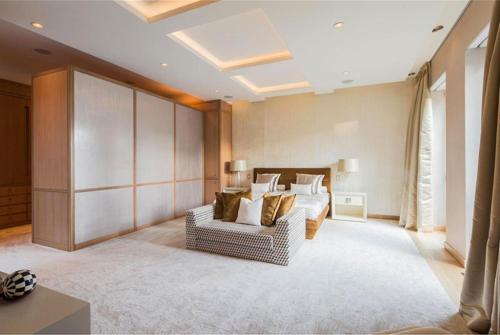 a living room with a couch and a bed at Rasila SoHo in New York
