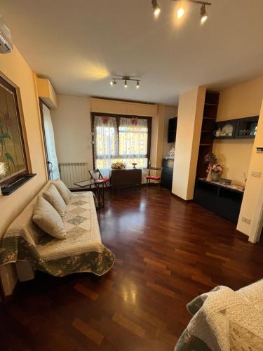 a living room with a couch and a table at Ostia Sunsets • Home near Rome and Airport in Lido di Ostia