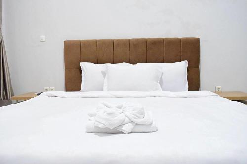 Voodi või voodid majutusasutuse Villa Victoria Bukittinggi toas