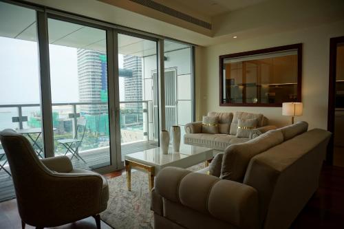 a living room with two couches and a table at Opulent Comfort in Colombo