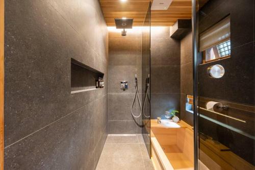 a bathroom with a shower and a sink at IRIRU Luxury Hanok Stay - Eunpyung Hanok village in Seoul